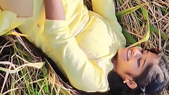 A Charming Girl In Yellow Attire Engages In Sexual Activity In A Field With A Well-Endowed Partner, Including Oral And Manual Stimulation Of The Genitals